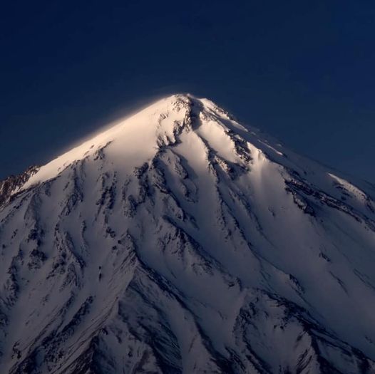 Mount Damavand greets the first rays of sunlight at dawn