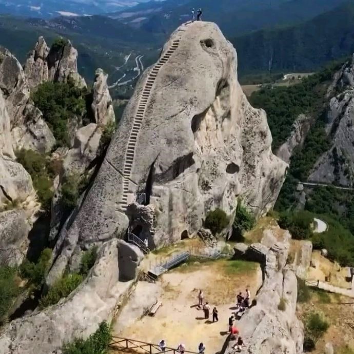 The 54 steps of the Norman staircase are carved into the rock of one of the mountain towers that overlook the ancient village of Castelmezzano, in the Lucanian Dolomites